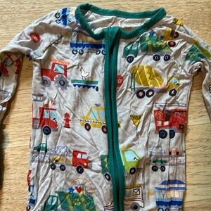 Little Sleepies 6-12m zippie in trucks. GUC
